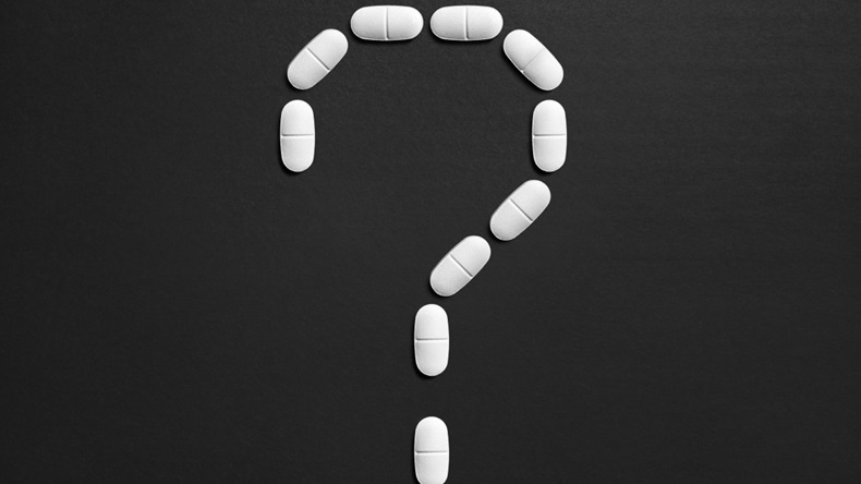 Question mark made of pills 