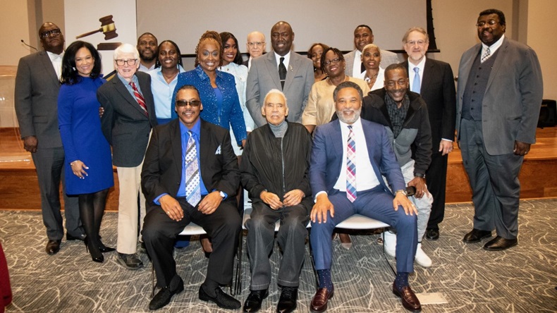 Photograph of Henrietta Lacks' descendants (son Lawrence Lacks and grandsons Ron Lacks and Alfred Carter) as well as members of their legal team (Ben Crump, Kim Parker, Robert Klonoff, Christopher O'Neal) and Southern University representatives (John Pierre and Deleso Alford)