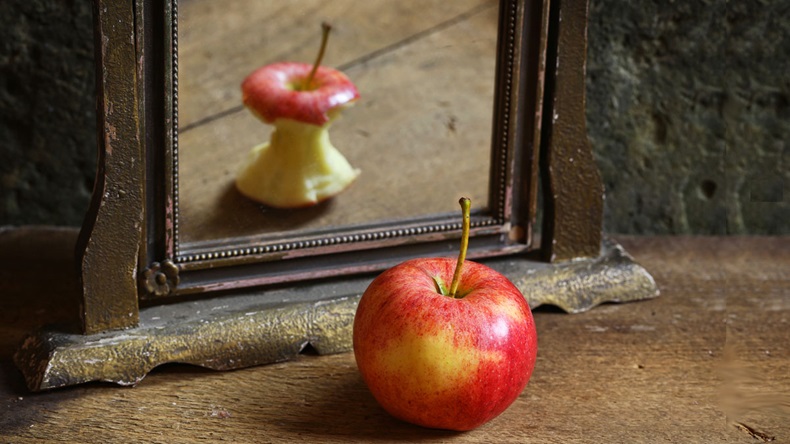 Apple reflecting in mirror
