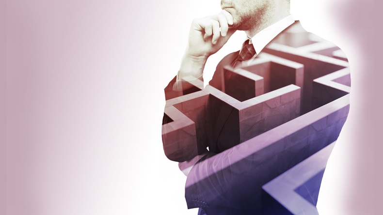 Young businessman thinking about ways to overcome business obstacle. Isolated with maze and copy space. Double exposure